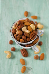mixed nuts on wooden surface