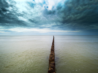 Obraz premium Old fishing boat pier at Baltic sea coast.