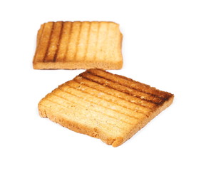 Integral fried whole wheat toast bread slices isolated on white background