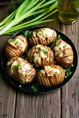 Stuffed potatoes with bacon, green onion and cheese