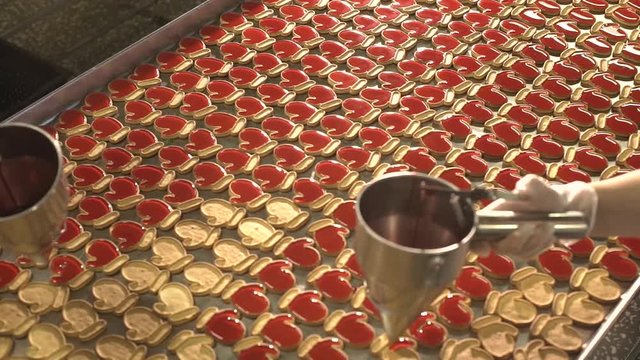 Jam pour into the cookies. Jam and cookies. Red jam. Red cream.