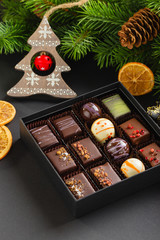 Set of coloful luxury handmade bonbons in box on christmas background