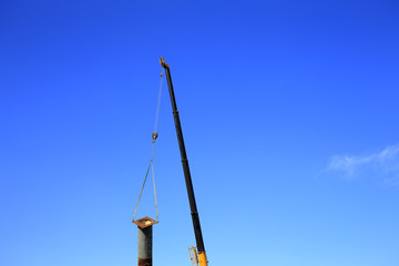 Obraz premium The crane is working in the air