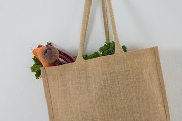 Fresh vegetables in grocery bag