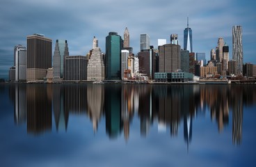 Fototapeta na wymiar NEW YORK, UNITED STATES OF AMERICA - APRIL 30, 2017: Manhattan downtown skyline from the Brooklyn Bridge Park in New York City.