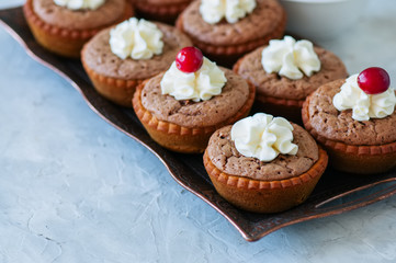 Brownie mins pies on a vintage tray.