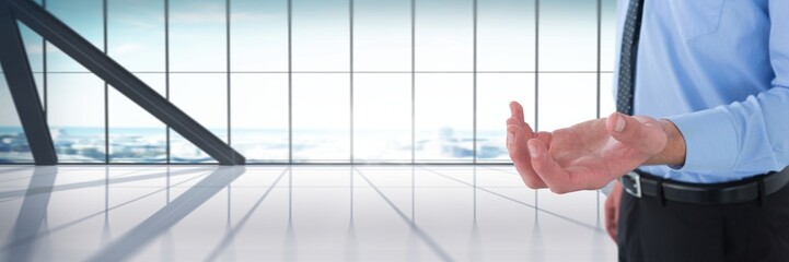 Businessman with hand palm open in city office