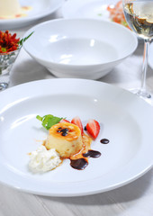 plate of pudding with fresh fruit - close up