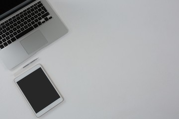 Fototapeta na wymiar Laptop, digital tablet and pen on white background