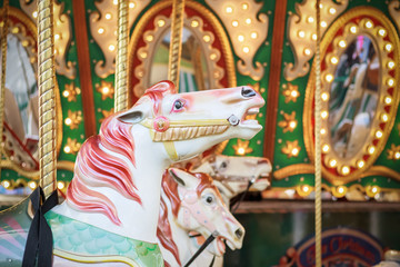 Fototapeta na wymiar Carousel, merry go round, at Christmas funfair winter wonderland