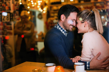 Young attractive couple on date in bar