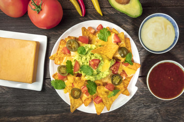 Nachos with cheese, traditional Mexican snack, with ingredients