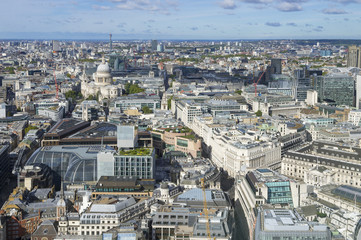 Scenic view of the London City skyline with St Paul's Cathedral and the Bank of England standing in slanted morning light