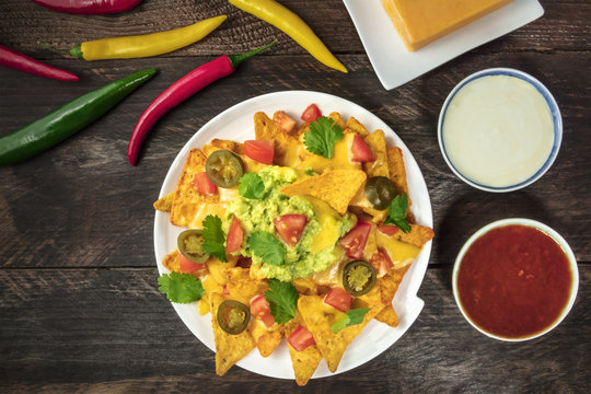 Nachos with cheese, traditional Mexican snack, with ingredients
