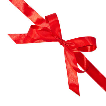Shiny red bow and ribbon isolated on white background