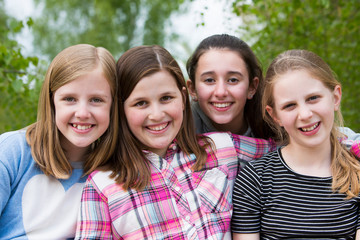 Portrait Of Young Girls Having Fun In Park Together