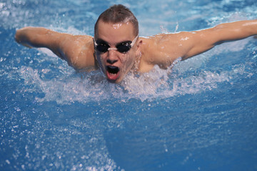 Male swimmer at the swimming pool. Underwater photo. Male swimmer.