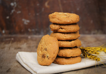 Oatmeal raisin cookie isolated on a wooden background