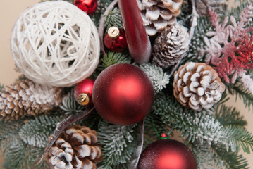 Christmas Background. A Fir Branches Twigs and cones Wreath. Candle and Red Globes. Top view.