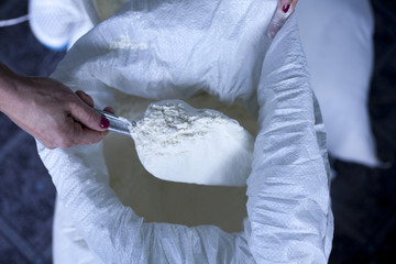 flour baker in kitchen close up on hand