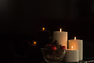 A new year decoration with reflections of candlelight on the glossy surface