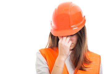 Engineer girl with hardhat got headache
