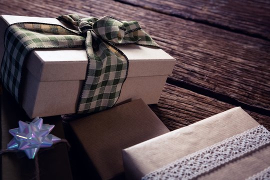 Various gift boxes on wooden plank