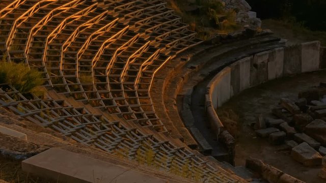 Telephoto establishing shot of the Ancient Theater in Limenas Thassos, Greece in the North Aegean Sea, the northernmost Greek island. Thasos is the northernmost Greek island, and 12th largest one.