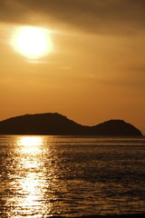 Fototapeta premium The setting sun and island