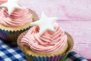 Christmas cupcakes with a star on the wooden table