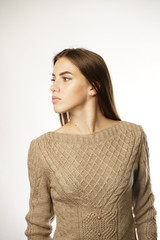 the girl in the beige sweater over a white background