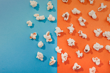 Popcorn on a colorful  blue orange background