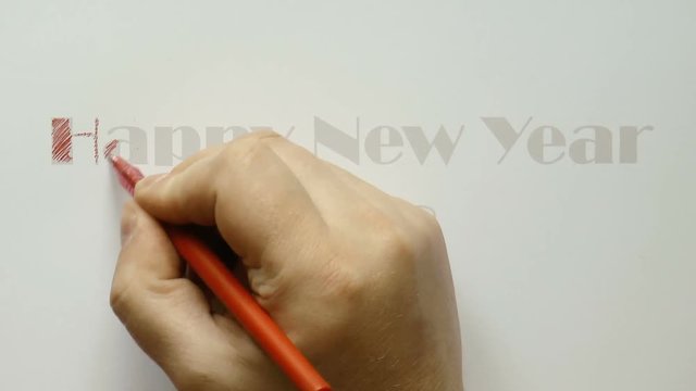 The video shows man writing red pen with a happy new year