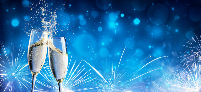 Toast With Champagne And Fireworks In Shiny Night
