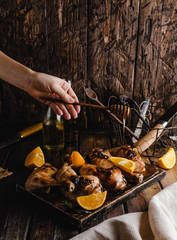 cropped shot of woman pouring honey onto tasty grilled meat