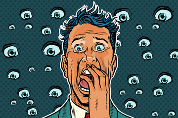 Horrible background with eyes and a frightened man