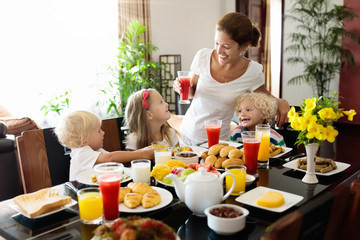 Healthy family breakfast for mother and kids.