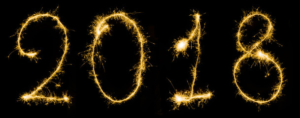close up view of sparkling 2018 year sign isolated on black