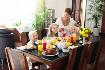 Healthy family breakfast for mother and kids.
