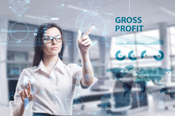 The concept of business, technology, the Internet and the network. A young entrepreneur working on a virtual screen of the future and sees the inscription: Gross profit