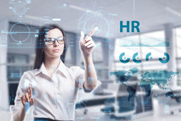 The concept of business, technology, the Internet and the network. A young entrepreneur working on a virtual screen of the future and sees the inscription: HR