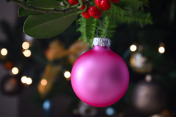 Merry christmas pine tree with balls decoration with blurry bokeh light background