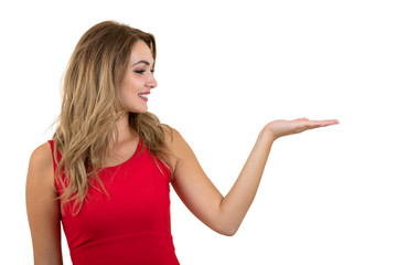 Woman pointing at sign. Young beautiful sexy woman showing copy space on empty blank sign or gift card.