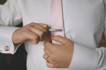 man dressing fitting shirt