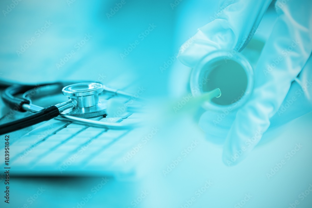 Poster composite image of close-up of keyboard with stethoscope