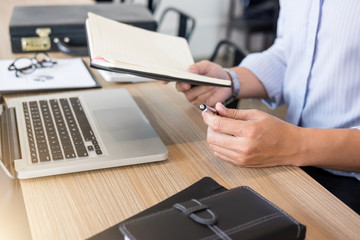 Fototapeta premium Professional businessman working at workplace with report, Doing finance on laptop, document graph and analysis business strategy to development profit