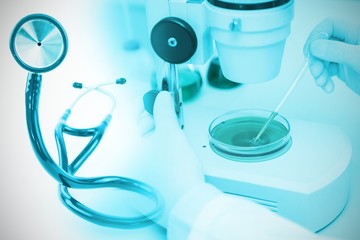 Composite image of blue stethoscope 