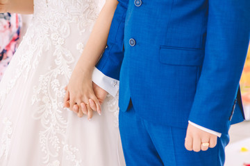 bride and groom hand in hand