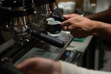 Waiter and waitress working at counter