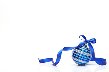 Blue Christmas ball with ribbon bow on white background